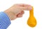 Man hand holding a yellow deflated balloon on