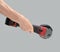 Man hand holds brushless cordless angle grinder on gray background