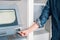 Man hand inserting credit card in an atm