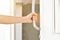 man hand open the door holding handle