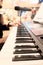 Man hand play synthesiser electronic keyboard