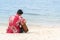 Man hand playing guitar on the beach. Acoustic musician playing  classic guitar. Musical Concept