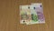 Man hand put different money cash euro banknote on table. 4K