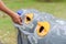 Man hand put used bottle in recycle bin