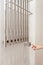 The man hand regulates thetemperature in the heated towel rail