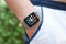 Man hand smart touch watch with home screen icons apps