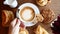 Man Hand Take a Cup of Coffee from Wooden Table with Baked Pastry, Breakfast