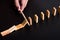 man hand using a pen stop domino falling effect on black background ,using idea to solve the problem