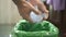 Man hand view while trashing used plastic bottle on separate garbage bin,recycle