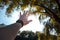 man hand with watch on wrist sun rays through palm