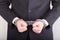 Man with handcuffs, business suit