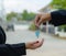 Man handing a house key to a woman