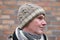 Man in handmade knitted winter beanie hat