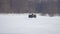 Man on a handmade motorcycle all-terrain vehicle rides on snow