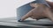 Man hands check bottom of blue ceramic bowl