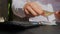 Man hands counting expenses banknotes of euro cash count on calculator. Close up of hands unrecognizable Businessman