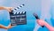 Man hands holding movie clapper.Film director concept. hands holding Microphone in interview or broadcast wedding ceremony,