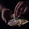 Man hands holding USSR rubles, money on a black background, close-