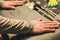 Man hands lay on snowboard base before wax in repair shop. Service and snowboard preparation concept