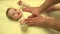 Man Hands Massaging Newborn Baby Body. Closeup. 4K UltraHD, UHD