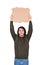 Man with hands outstretched holding a blank cardboard sheet over head as participates in a street demonstration or protest. Blank