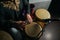 Man hands playing music at djembe drums