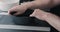 Man hands sand bottom of black ceramic bowl