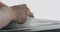 Man hands sand bottom of white ceramic bowl