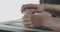 Man hands sand bottom of white ceramic glass