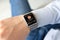 Man hands smart touch watch with app tracking delivery package