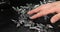 Man hands take in handful Roofing self-tapping screws