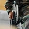 Man, hands and wheelchair in army from accident, war injury or healthcare support at hospital. Closeup of soldier or