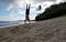 Man Handstand on beach as wave roll on to shore