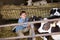 Man happily stroking cows