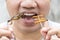 Man happy opening his mouth eating Bamboo Worms and Crickets insect. Food Insects for eat as food items, it is good source of meal