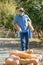 Man harvests big pumpkin from patch.