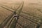 Man has a rest and dream in countryside. Young man sitting on the chair in the field. Aerial panoramic view.