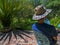 A man with a hat protecting himself from the midday sun