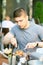 Man having cheeseburger in restaurant