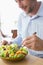 Man having food salad