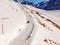 Man having fun with his sleigh in the alps of switzerland between First and Faulhorn