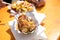 Man having German Currywurst sausage with curry sauce, French fries and mayonnaise on food market