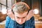 Man in headphones holds luminous bulbs near his head