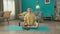 A man in headphones, listens to music from a smartphone, sits in a lotus position, meditates. Portrait of a man in