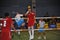 Man heads the ball in Kick Volleyball, sepak takraw