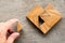 Man held piece of tangram puzzle to fulfill the heart shape