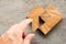 Man held piece of tangram puzzle to fulfill the heart shape