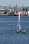 Man at helm of small sailboat in Fairhaven