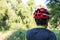 Man with helmet glove for safety riding a bicycle at countryside road along a forest,Cross country riding,cycling activity and