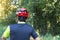 Man with helmet glove for safety riding a bicycle at countryside road along a forest,Cross country riding,cycling activity and